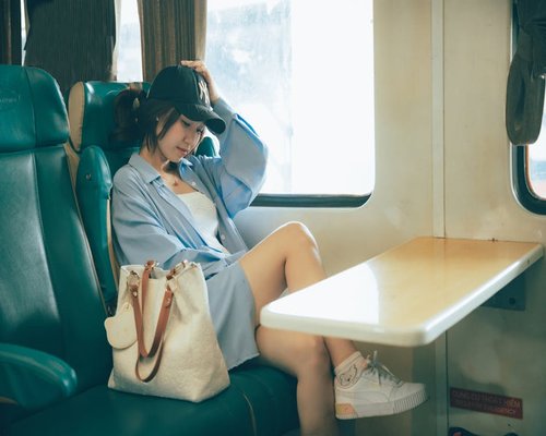 urban commuter sitting on train with relaxed posture
