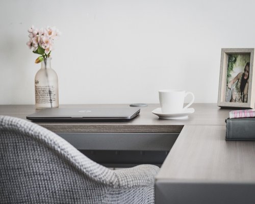 stretching arms at home workspace during afternoon